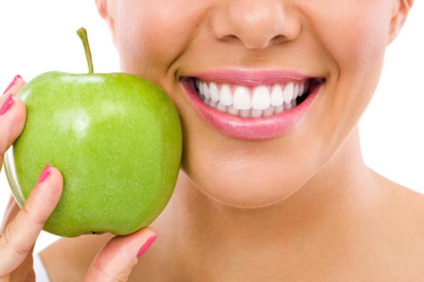 Girl with apple and nice smile Girl with apple and nice smile